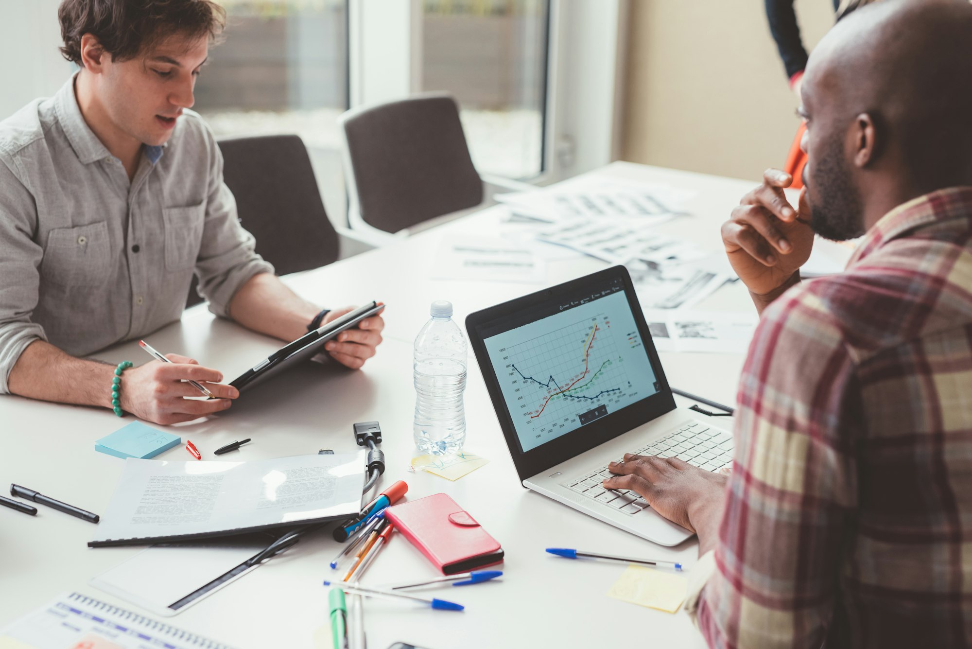 young adult teacher having workshop in modern office